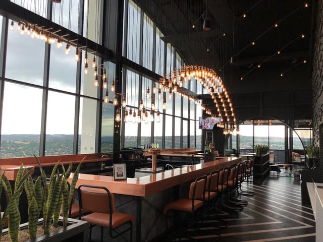 Contemporary lounge at Courtyard Hotel with large windows for events and networking.