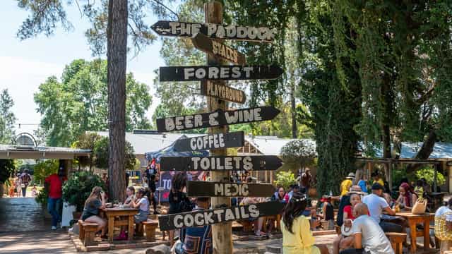 Farmers' market at Riversands Farm with directional sign, perfect for events and networking.