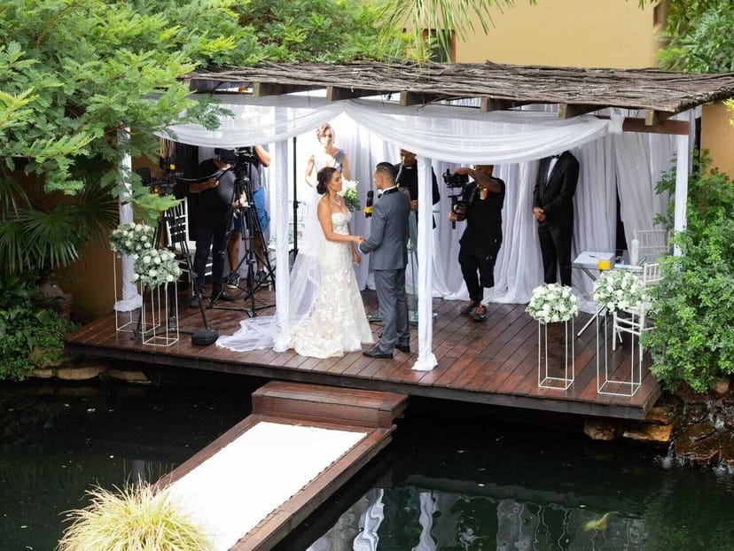 Outdoor wedding ceremony in The Elephant Hall, featuring a decorated gazebo and floral arrangements.