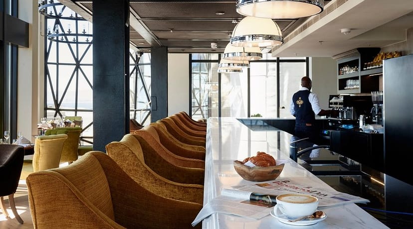 Elegant Granary Café bar with natural light, perfect for meetings and networking events.