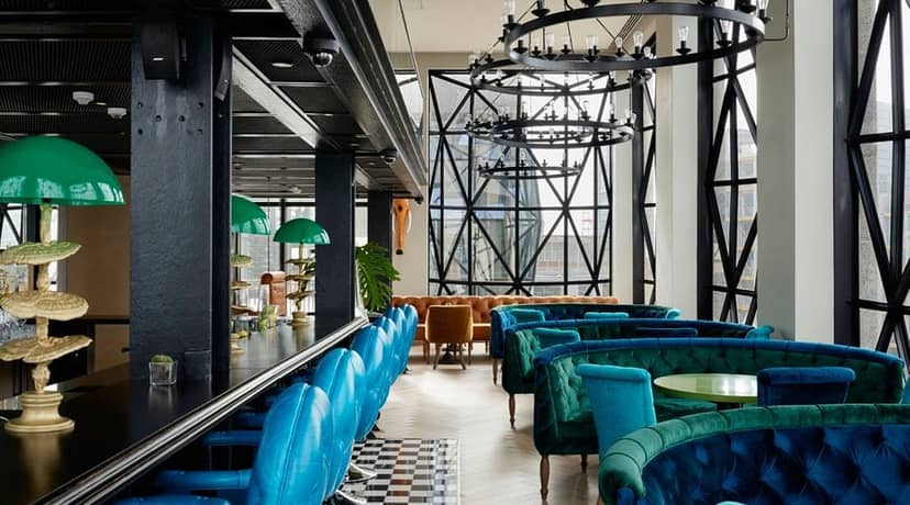 Sophisticated Willaston Bar with blue seating, ideal for networking and private events.