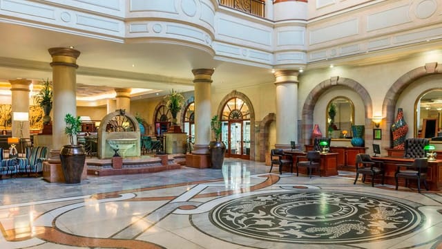 Elegant Sheraton Pretoria Hotel lobby, ideal for meetings and events with stylish decor.