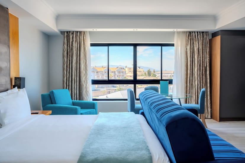 Modern hotel room at Blaauwberg Beach Hotel, ideal for corporate retreats and meetings.