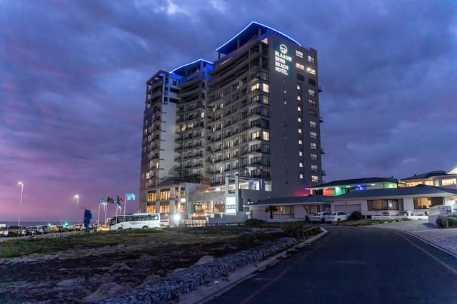 Modern hotel with LED lighting at twilight, perfect for events and conferences in Blaauwberg.