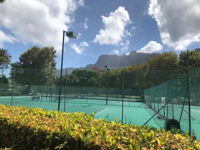Brodie Suite tennis court with mountain views, perfect for wellness events and team-building.