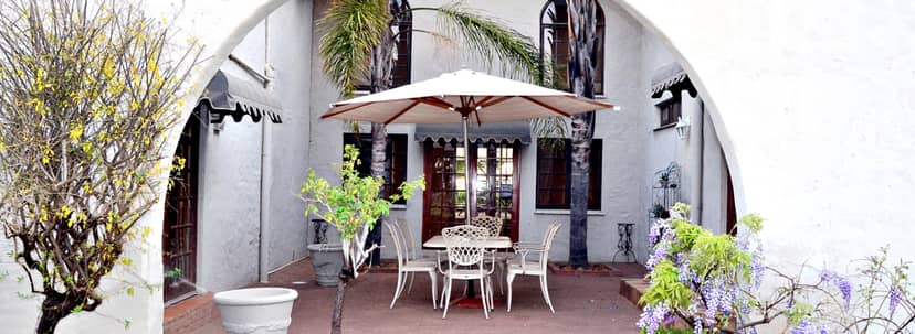 Charming outdoor chapel venue with patio, perfect for intimate gatherings and receptions.