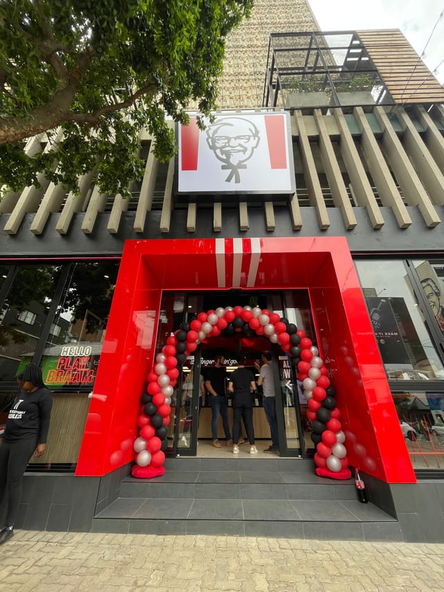 Vibrant entrance with balloon arch for festive event in Braamfontein.