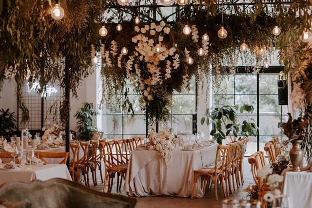 Elegant Tobacco Shed venue with lush greenery, perfect for upscale events and receptions.