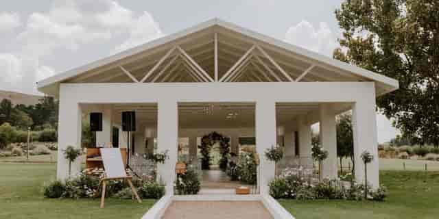 Elegant event space with natural light, perfect for weddings and corporate gatherings.