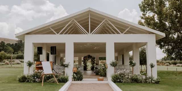 Elegant event space with natural light, perfect for weddings and corporate gatherings.