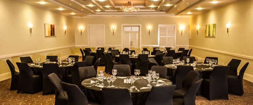 Auctioneers in Gold Reef City, elegant round tables set for corporate events and banquets.