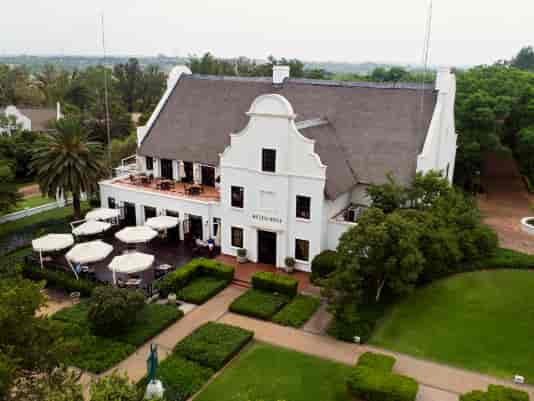 Kievits Kroon Conference Centre with thatched roof, perfect for corporate events and retreats.