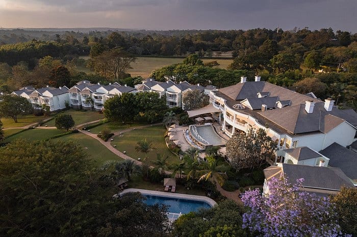 Pilar at Hemingways Nairobi: elegant resort venue with lush greenery for corporate events.
