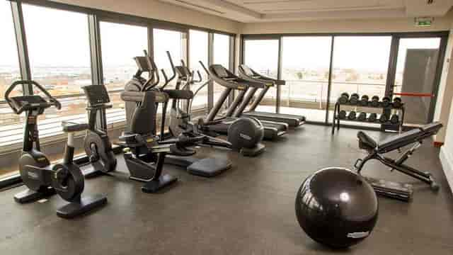 Conference Room at Hilton Garden Inn Nairobi Airport with fitness equipment for corporate wellness events.