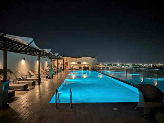 "Rooftop pool at Hilton Garden Inn Nairobi Airport for upscale evening events"
