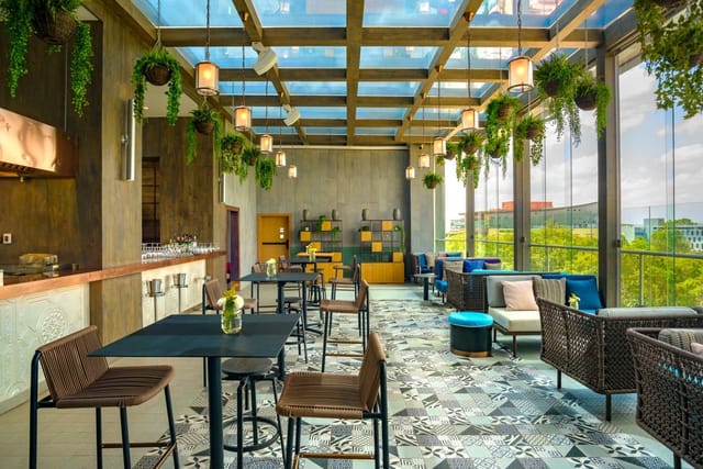 Modern event space with glass ceiling, perfect for meetings and upscale gatherings.