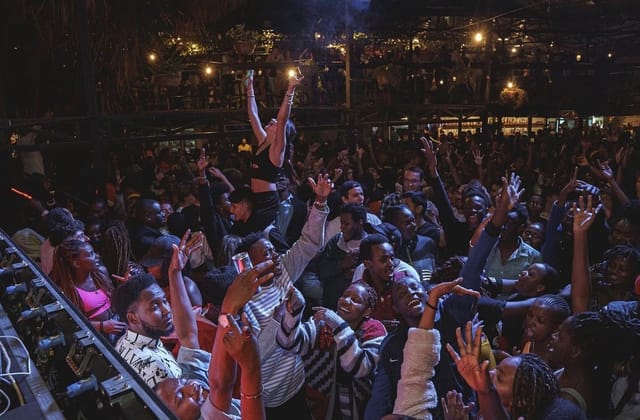 Vibrant crowd enjoying energetic performance at The Alchemist, Nairobi event.