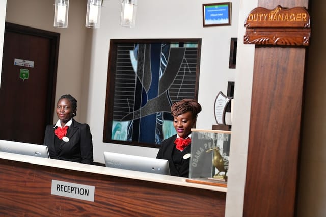 Garden Restaurant reception at Hillpark Hotel, warm lighting, event venue staff.