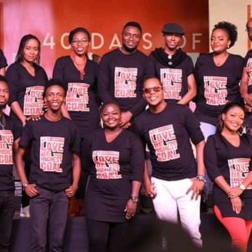 Diverse event staff in branded shirts at Karura Community Chapel, showcasing teamwork and engagement.