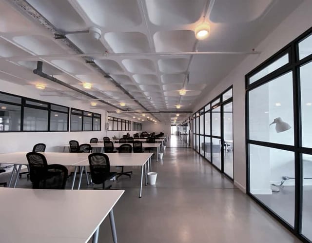 Modern coworking space in Nairobi Garage with ample natural light for meetings and events.
