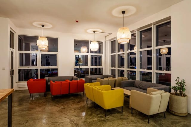 Pinetree Meeting Room in Nairobi Garage: vibrant lounge for networking events.