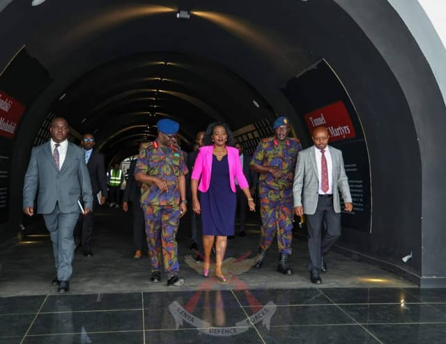 Tunnel of Martyrs, formal event with security personnel and networking focus.