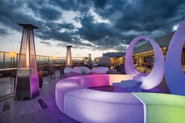 Stylish rooftop bar at Emara Ole Sereni Hotel with panoramic views for evening events.