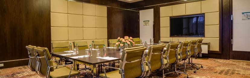 Meeting Room 1 at Crowne Plaza Nairobi Airport with modern furnishings for business events.