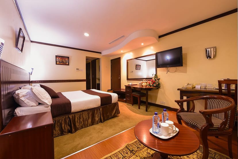 Conference room at Utalii Hotel with seating area, ideal for meetings and events.