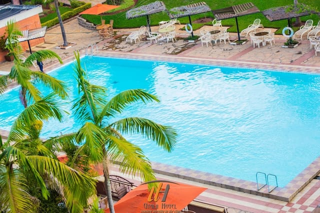 Conference room at Utalii Hotel with vibrant pool, ideal for events and gatherings.