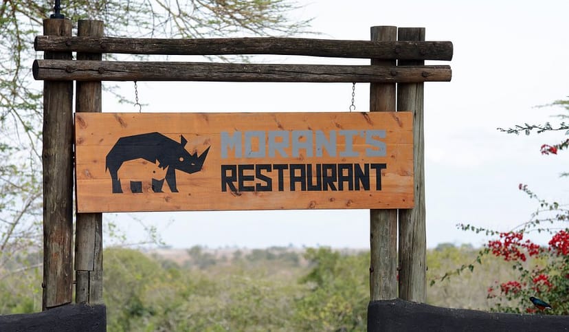 Morani's Restaurant sign with rhino design at Ol Pejeta for events and retreats.