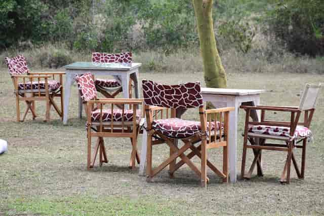 Morani's Restaurant outdoor event setup with giraffe-patterned cushions in Ol Pejeta.