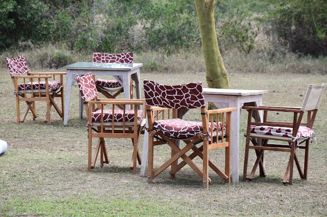 Morani's Restaurant outdoor event setup with giraffe-patterned cushions in Ol Pejeta.