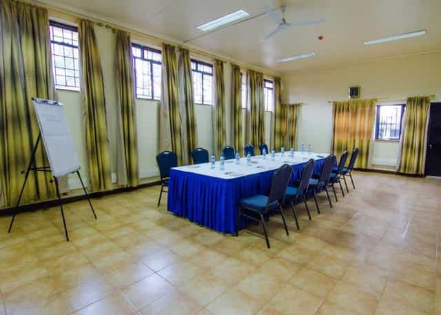 Conference Hall 3 at CHAK Guest House, featuring a central table for corporate meetings.