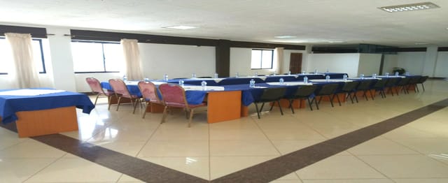 VIP lounge at Meru Paramount Hotel with U-shaped seating for meetings and workshops.