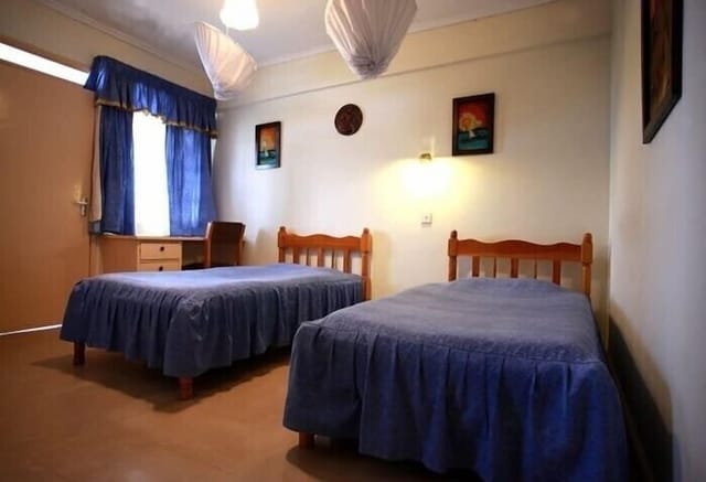 Conference Room in Shalom House with twin beds, ideal for budget-friendly events.