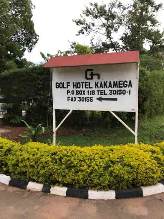 "Golf Hotel Kakamega signage amidst greenery, ideal for meetings and events."