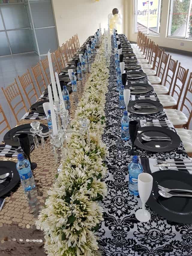 Elegant event table at Royal Nairobi Golf Club, black and white decor for upscale gatherings.