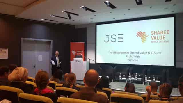 JSE Foyer presentation space with engaged audience at Johannesburg Stock Exchange event.