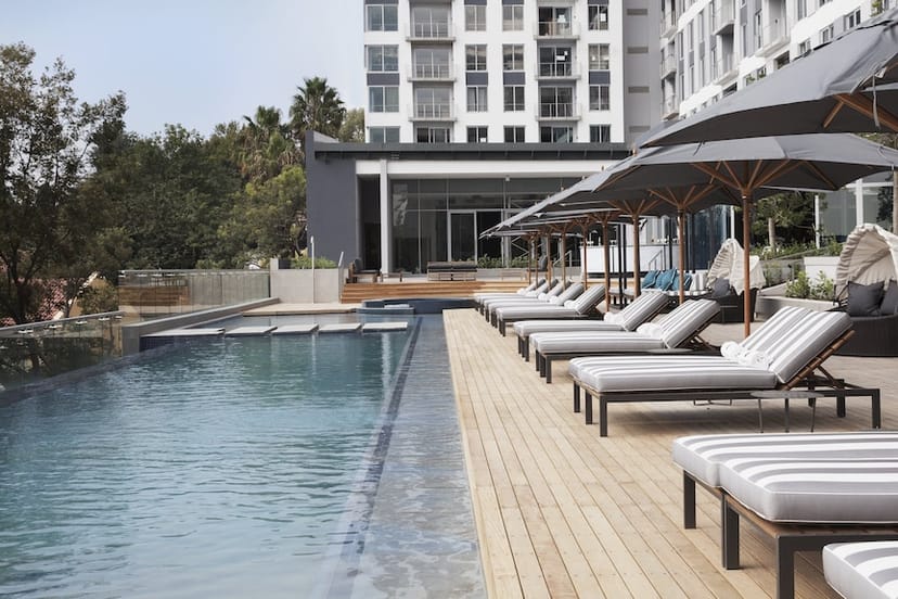 Stylish outdoor pool area at The Capital On the Park ideal for networking events and conferences.