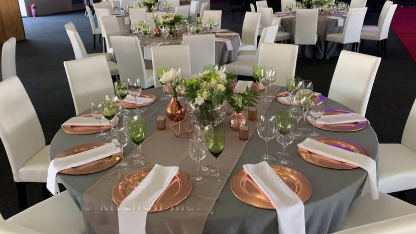 Elegant wedding venue at The Wanderers Club with gray and rose gold decor.