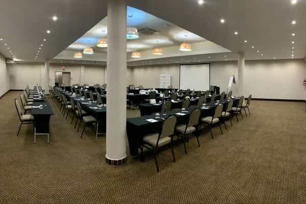 Spacious U-shaped conference room at The Capital Conference Venues for meetings and presentations.