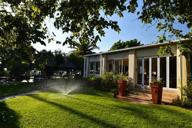 Serengeti 2 venue in CedarWoods, featuring lush lawn for outdoor meetings and events.