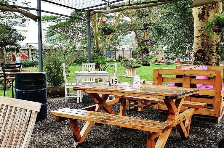 Outdoor meeting space at Pallet Cafe with rustic seating for casual gatherings.