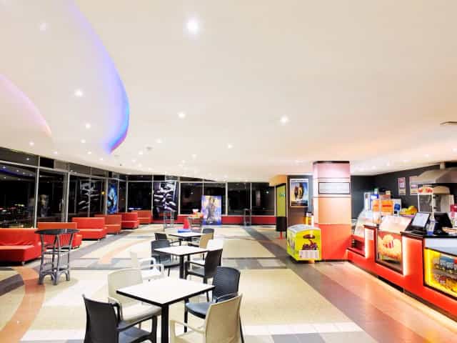 Modern Prestige Cinema venue with bright lighting, ideal for events and gatherings.