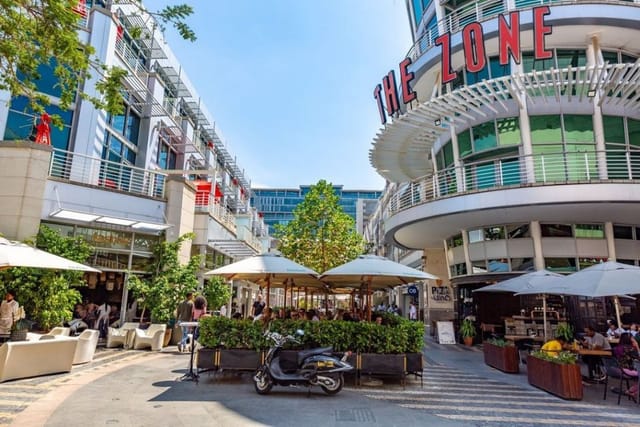 Vibrant outdoor event space at The Zone @ Rosebank with stylish seating and greenery.