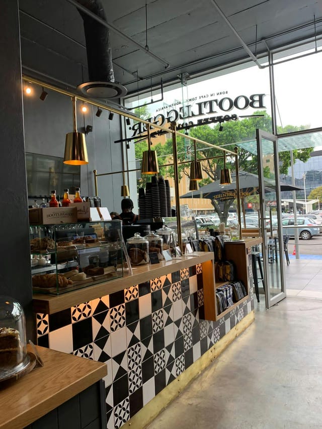 Modern café setup in The Zone @ Rosebank, perfect for networking events and casual gatherings.