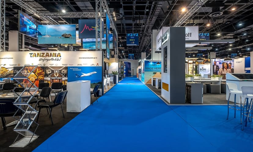 Exhibition space at Sandton Convention Centre with vibrant blue carpet for tourism events.