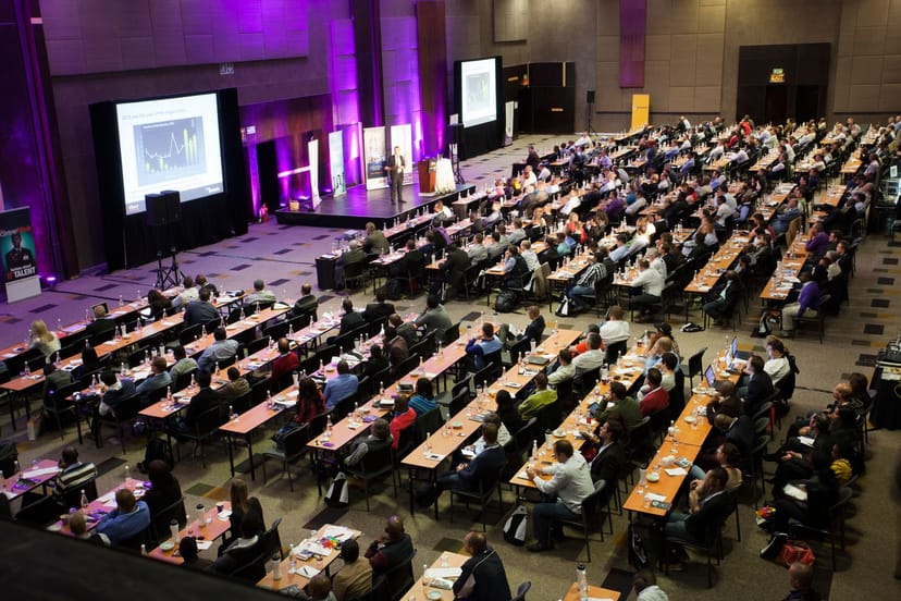 Sandton Convention Centre conference with tiered seating and interactive setup.
