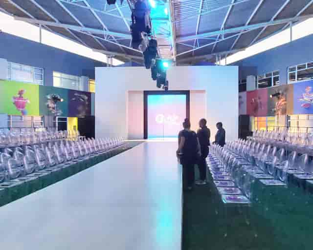 Dar Es Salaam Boardroom runway setup with transparent chairs for a stylish fashion show.